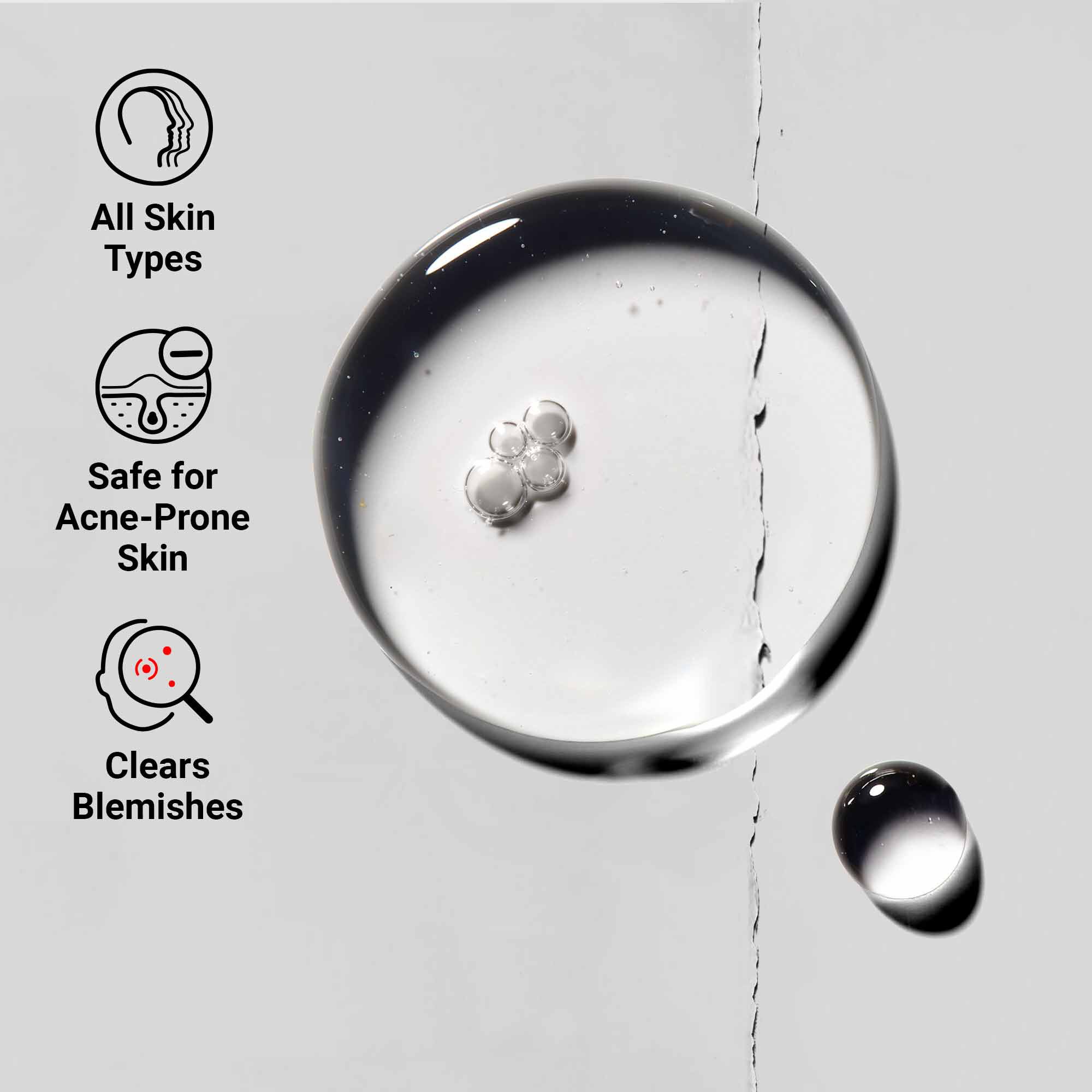 Primer plano de la textura de Truly-Targeted Blemish-Clearing Solution que muestra un liquido transparente con gotas. El texto destaca su idoneidad para todo tipo de pieles, seguridad para pieles propensas al acne y beneficios para eliminar imperfecciones.
