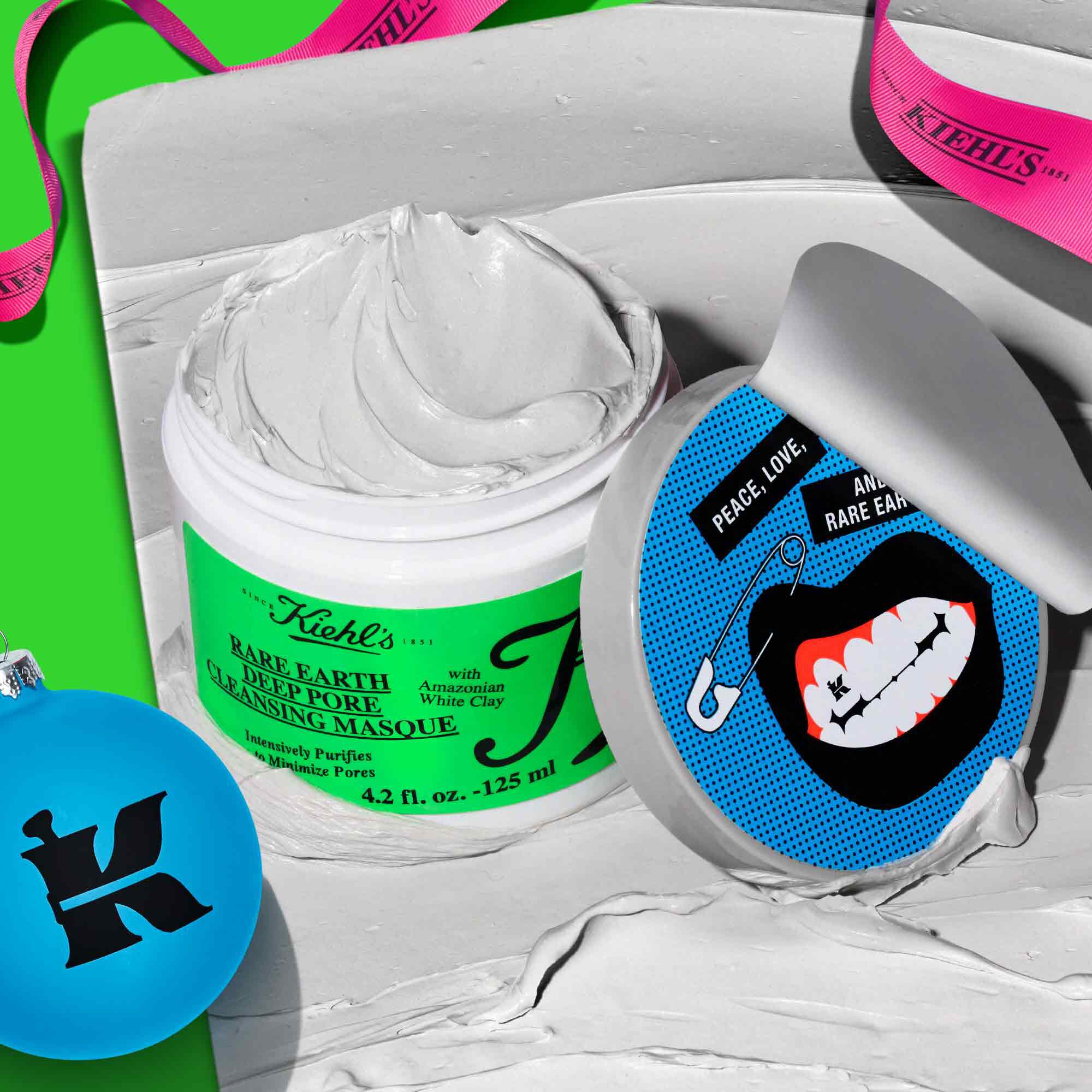 Open jar of Kiehl’s Rare Earth Deep Pore Cleansing Masque along with festive decorations 
