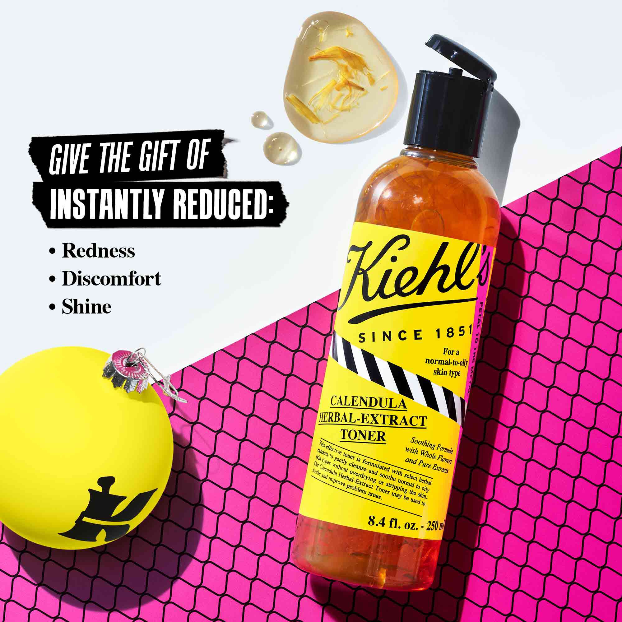  Image with a bottle of formula and ornament, states Give the Gift of Instantly Reduced Redness, Discomfort, Shine 