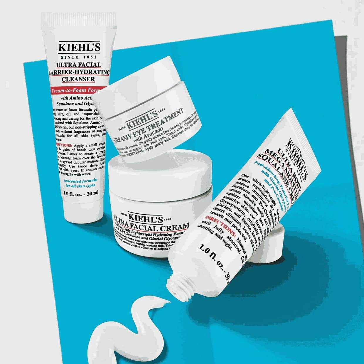 Kiehl's skincare products including Ultra Facial Cream, Creamy Eye Treatment with Avocado, and Ultra Facial Barrier Hydrating Cleanser, shown with promotional pricing and value.