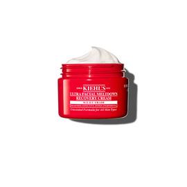 Tarro rojo de Kiehl’s Ultra Facial Meltdown Recovery Cream Whip con textura de crema batida.