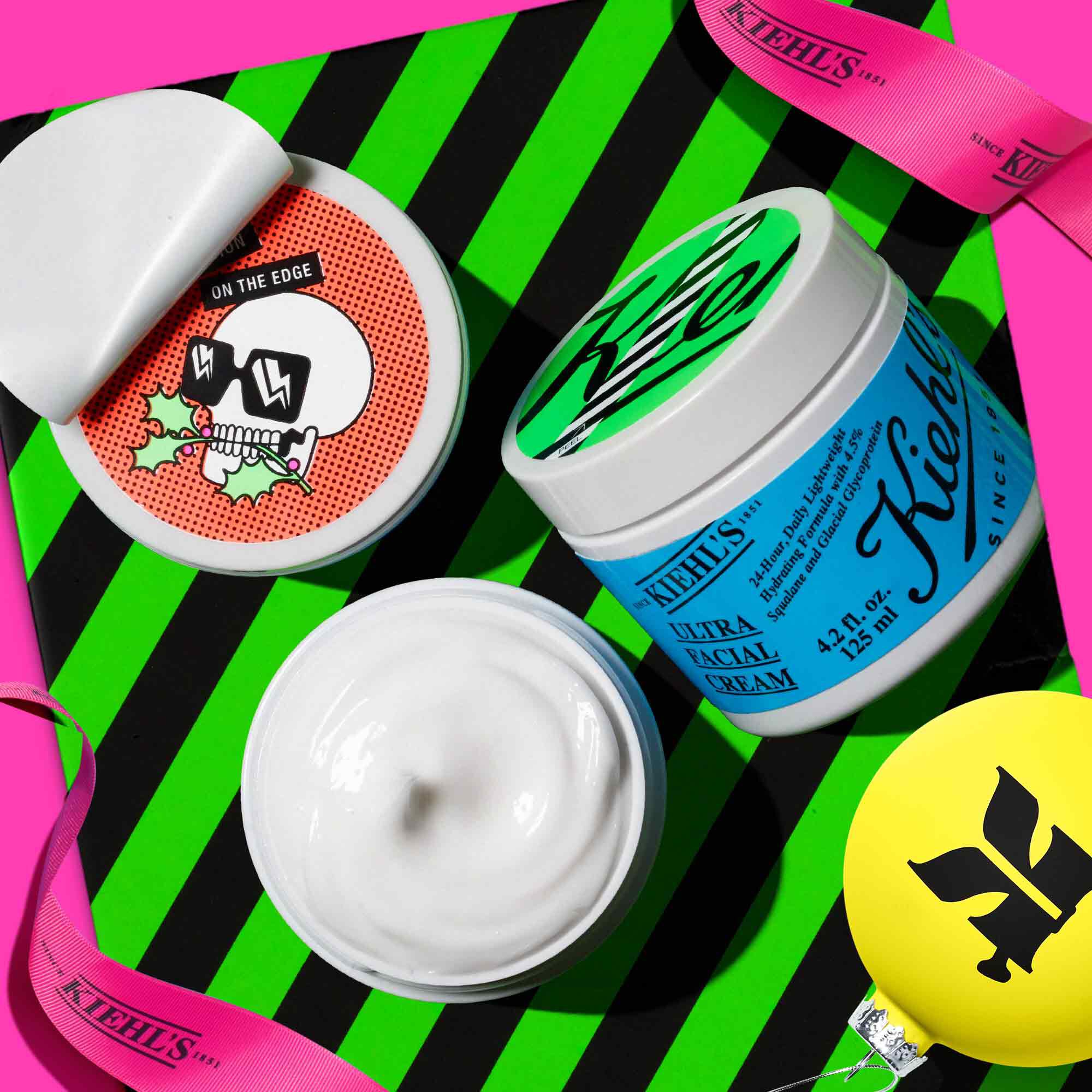 Open jars of Ultra Facial Cream with festive background imagery - 4.2 fl. oz./125ml size ​