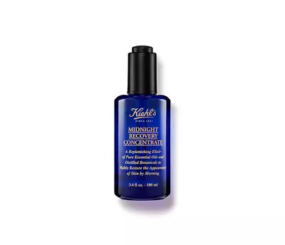 Botella de serum Kiehl's Midnight Recovery Concentrate, un elixir reparador de aceites esenciales para la piel.