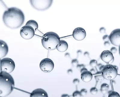 A close-up view of transparent molecular structures, featuring interconnected spheres representing atoms, with a light background.