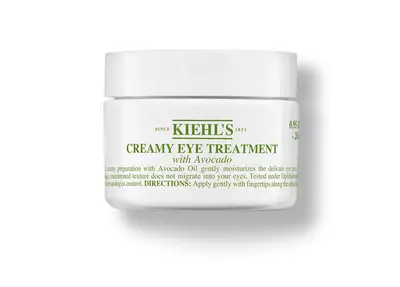 White jar of Kiehl's Creamy Eye Treatment with Avocado, featuring green text and a lid, designed for moisturizing under-eye skin.