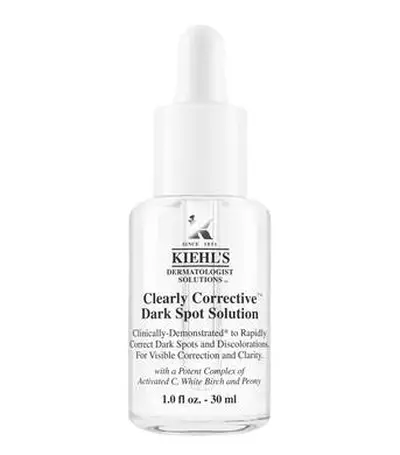 Botella de suero Kiehl's Clearly Corrective, solucion para manchas oscuras, 30 ml, con extractos de peonia y birch blanco.