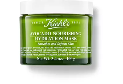 Tarro de mascarilla hidratante de aguacate de Kiehl's, que suaviza y nutre la piel, con un diseno verde brillante.