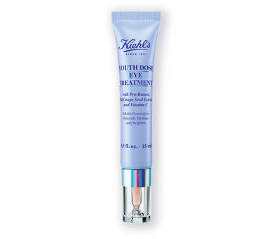 A tube of Kiehl's Youth Dose Eye Treatment featuring a light purple design, claiming multi-pronged benefits for the eye area.