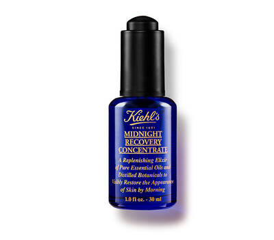 Botella de suero concentrado Midnight Recovery de Kiehl's, en envase azul oscuro, ideal para la recuperacion nocturna de la piel.