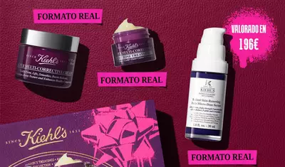 A graphic displays three Kiehl's products and a gift box against a dark red background with bright pink graphic elements. A purple jar of " Kiehl's SUPER MULTI-CORRECTIVE CREAM" is on the left, labeled "FULL SIZE" in a pink box. Above it is a smaller purple jar of " Kiehl's SUPER MULTI-CORRECTIVE EYE ZONE TREATMENT", also labeled "FULL SIZE" in a pink box below it. On the right, a white and purple bottle of "KIEHL'S Retinol Skin-Renewing Daily Micro-Dose Serum" is visible, with a pink box below it stating "FULL SIZE". A larger pink graphic splash in the upper right corner announces "VALUE $184".