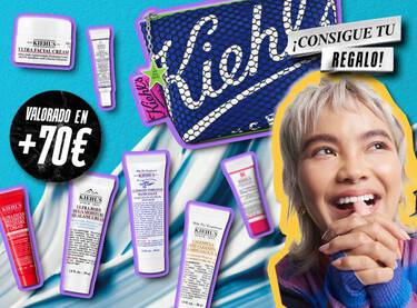 Regalo Kiehl's valorado en mas de 70 €: neceser y minitallas de cuidado facial junto a una mujer sonriente.