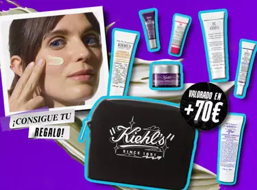 Neceser negro Kiehl's y minitallas de regalo valoradas en mas de 70 € junto a modelo aplicando crema.