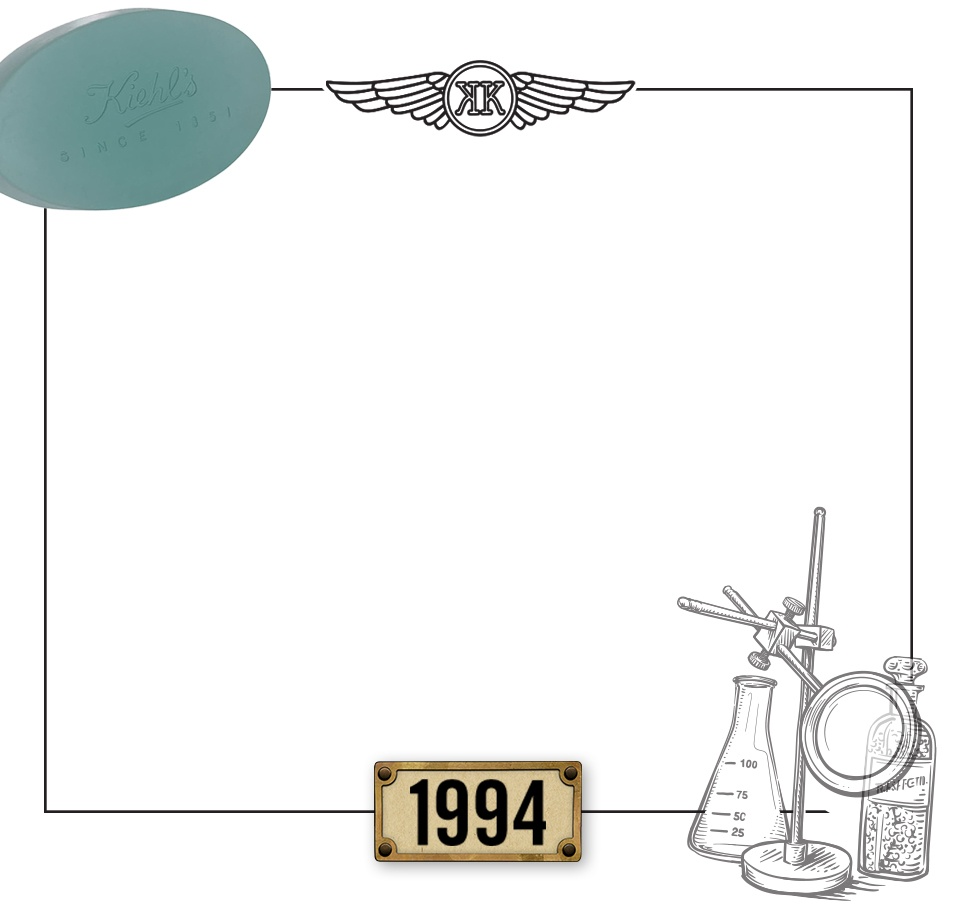 Barra de jabon de la marca Kiehl's en color verde, con una ilustracion de frascos de laboratorio y la fecha "1994".